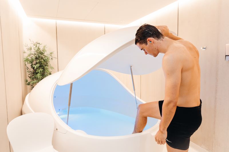 A man coming out of the float tank after taking the float therapy