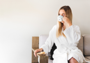 A woman having a cup of tea before the float therapy